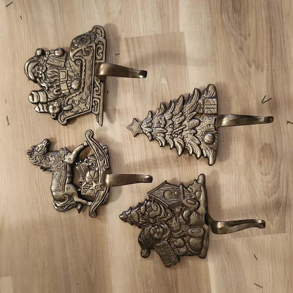 Noel Grandure vintage cast iron mantel stocking holders.  Set of 4